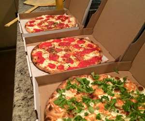to-go pizzas in boxes